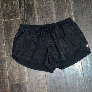 Matte black cheetah print running shorts